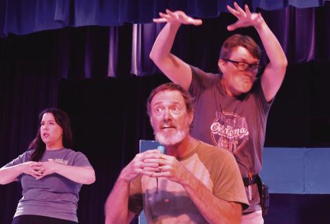 David Timmons (front center) performs a dramatic monologue during rehearsal of “Drop Dead!” on July 10 along with Chevy Carter (right) and DaNae Peters (left). The production is one of three that will be performed during the Stroud Arts Festival this year. Photo/Emily Kalka