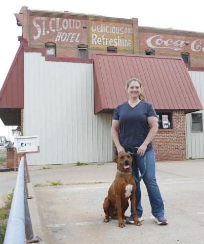 Right, Theresa McKinzie stands in front of her condemned clinic, The Lincoln County Animal Hospital. Photo/ Brian Blansett