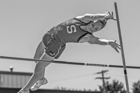 Above, Kenlee Parrick from Stroud clears the bar en route to winning the regional pole vault Saturday. Right, Audrey Donaldson waits in the exchange zone during the Lady Tigers’ record-breaking 4x200 relay. Below, Kileigh Mixon on her way to winning the high jump, one of three first-place individual championships. Bottom, Peyton Davis comes out of the starting block in the 100-meter dash, which she won. Photos/Mario Holland