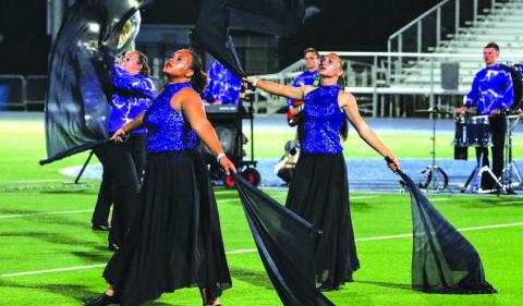 Heaven Richmond (left) and Lizzy Pryor (right) perform during finals at the OBA State Championships in Chandler High School’s program “Through the Storm.” Photo/Jennifer Pryor