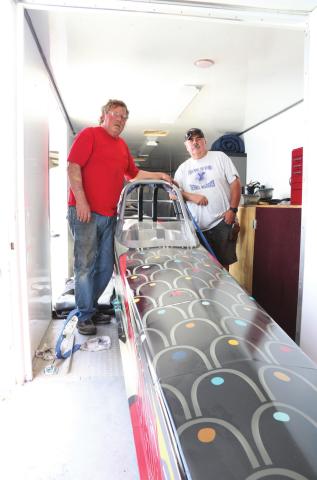 Ralph Snider, left, and Marcus Parks in the trailer with Snider’s jet dragster. Photo/Kendra Johnson