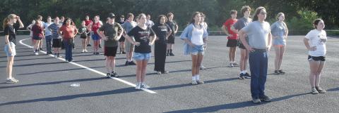 The Pride of Meeker marching band lines up to go through marching drills in the parking lot next to the high school with Drum Major Holly Turner (far left) looking on. The band is 42-strong this year, and ready to hit the field and competitions. Photo/Emily Kalka