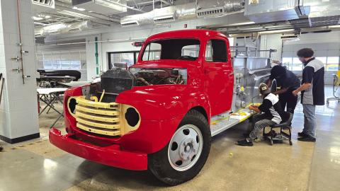 The team at Francis Tuttle works to finish renovating the old Wellston fire engine. Photo/Todd Beesley