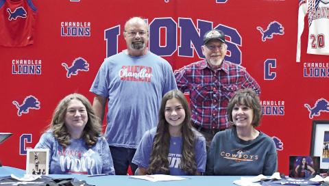 Chandler’s Kaitlyn Aucoin signed a letter of intent last week for Oklahoma City University’s stunt team. She is pictured above with, back row, Robbie Aucoin and Robert Stieber and, front row, Robbi Aucoin and Rita Stieber. Photo/Brian Blansett