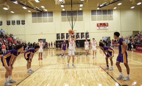 David King shoots the first of two game-clinching free throws for North Rock Creek against Anadarko Saturday night with 3.4 ticks left to play. Photo/Brian Blansett