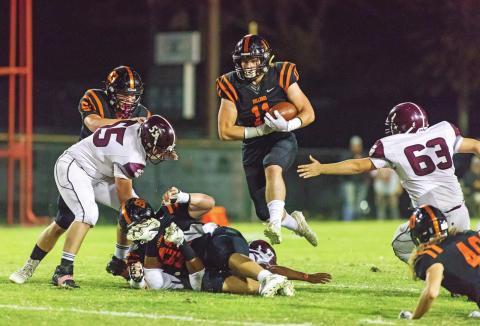 Davenport’s Parker Mitchell (11) clears the line en route to a touchdown run in the Bulldogs’ win over Foyil Friday night. Photo/Rick Hester