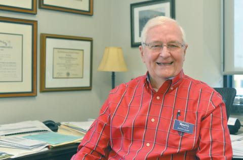 Danny Alsip, happy to be back in his office at BancFirst in Chandler after a nearly fatal case of COVID-19 and double pneumonia last winter. He was so ill that doctors told his wife, Rinda: “It could be any minute.” Photo/Brian Blansett