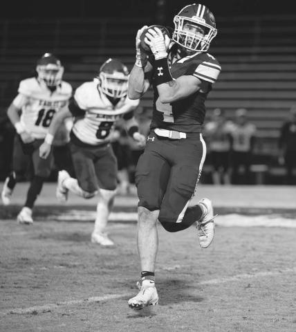 Jacob Beck collects a pass and looks upfield. A senior, Beck finished the game with 58 yards receiving, 24 yards rushing and two touchdowns. Photo/Beth Young