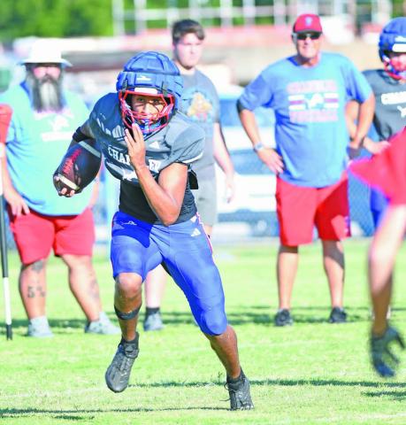 Senior Javarious Wade takes off on a long run during the Lions’ scrimmage against McLoud. Photo/Brian Blansett
