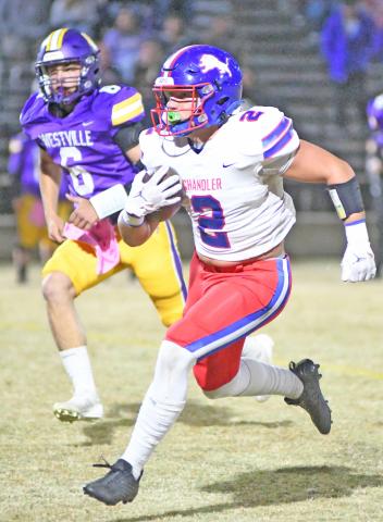 Grant McGinnis (2) heads for the end zone in the first half against Westville Friday night. McGinnis scored four touchdowns as the Lions ran out to a 42-0 lead at halftime. Photo/Brian Blansett