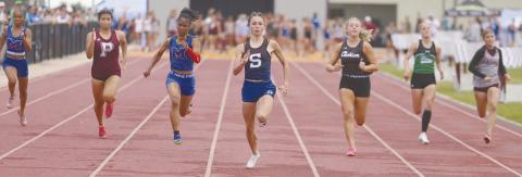 Stroud’s Peyton Davis, center, leading the pack in the 100 meter dash, one of three events she won at Cashion. Photo/Mario Holland