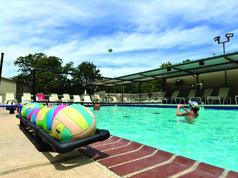Guests of Oaklake Trails Naturist Resort play volleyball in one of the park’s two pools on a warm summer day. COO Nate McPherson said the park has about 70 to 85 residents that live either full-time or seasonally at the 400plus acre resort and 662 annual memberships, the highest they’ve ever had. Photo/Nate McPherson