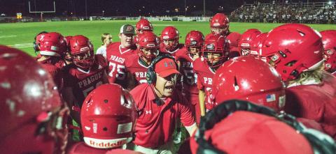 Prague coach Mike Hedge exhorts his players after a long scoring run on a fourth-down play in the Red Devils’ 52-14 win over Luther. Photo/Brian Blansett