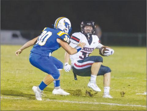 Meeker back Ajay Lynch (33) stomps on the brake pedal to let the defender pass to the outside. Photo/Rick Hester