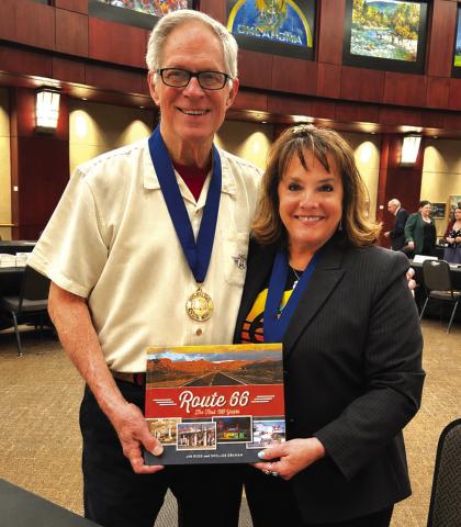 Left is Jim Ross and right is Shellee Graham. The two display their book on Route 66 while wearing their Oklahoma Book Award medallions. Photo Provided by Shellee Graham.