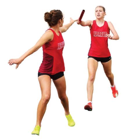 Harley Johnson hands the stick off to Prague teammate Hanna Rolette during the 4x800 relay at the 66 Conference track meet last week. Johnson, Rolette and teammates Hailey Johnson and Jocelyn Ward won the conference and have the fastest 4x800 time in the state in Class 3A. Photo/Mario Holland