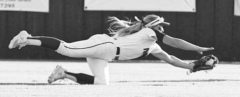 NRC’s Aubree Shivelhood and Chandler’s Gentry Garner made difficult look easy last week in super regionals. Above, Shivehood makes a diving catch against Tecumseh. Photo/Sheryl Gowin. Below, Garner makes a running backhand grab of a drive against Jones. Photo/Brian Blansett