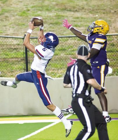 Chandler’s Karson Wilson (5) goes high for an interception in third quarter of the Lions’ game against Anadarko. Wilson’s interception stopped an Anadarko drive at the Lions’ 24-yard line and Jordan Denson scored on the next play to give Chandler a 22-13 lead. Photo/Brian Blansett