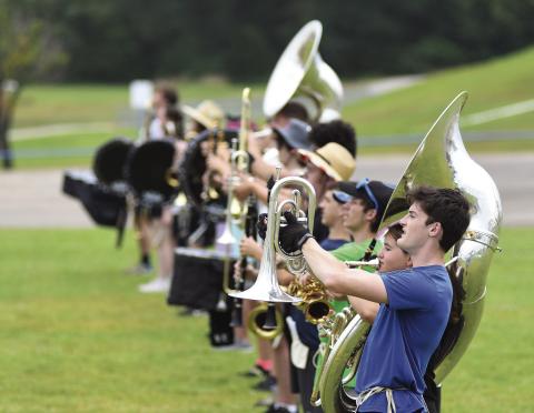 Senior Ian Radcliffe heads up the line of The Pride of Chandler on the last day of band camp on Aug. 3. New director Zac Fisher put the students through their paces in preparation for marching band season. Chandler plans to attend four competitions as well as performing at football games this year. Photo/Brian Blansett