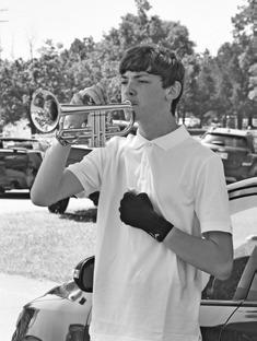Chandler student Landon Gray plays Taps at the American Legion’s annual Memorial Day ceremony on Monday, May 27 at Oak Park Cemetery. Chandler resident Cynthia Ferrell-Ashwood was the special speaker at the event attended by around 20 to 30 residents. Photo/ Emily Kalka