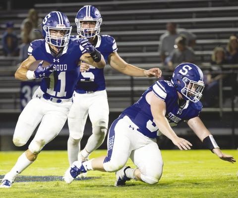 Senior running back Trystan Baker (11) motors for yardage against Meeker. Photo/Beth Young