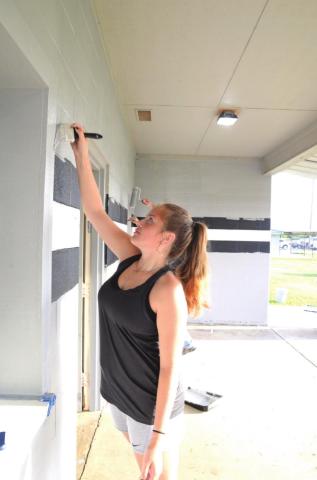 Painting the Meeker fieldhouse