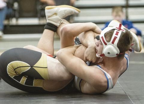 Chandler sophomore Bryar Dryden (white) pins his opponent with a spladle during a dual at Henryetta. Photo/Jennifer Pryor