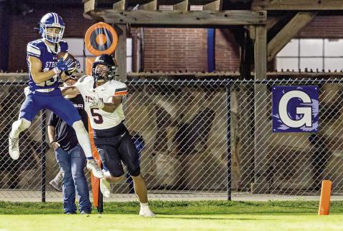 Aiden Collins intercepts a pass near the end of the game to preserve the Tigers’ victory. Photo/Beth Young.