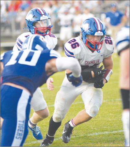 Carson Clagg (26) packs the rock on one of his 24 carries Friday night. Photo/Brian Blansett