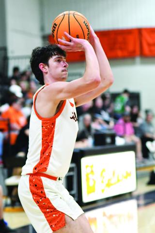 Trevor Edwards from Davenport lines up one of the 10 three-pointers he splashed Friday night against Moss. He finished the night with 38 points. Photo/Brian Blansett