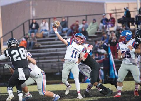 Chandler quarterback Kaden Jones throws during the first half of the Lions’ game with Meeker. Photo/Brian Blansett