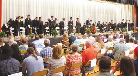 Pictured above, the seniors at Wellston High School take their seats and wait to begin their last high school ceremony, graduation. Over 30 seniors crossed the stage and became high school graduates at the Wellston Graduation, Friday, June 12. Photo/Jake Usry.
