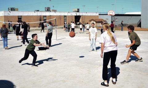 Meeker students play a variety of games on the school’s new Bulldog Square. Photo/Brian Blansett