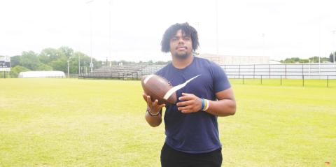 Tim Whitfield stands on the Meeker High School Football field. Photo/Jake Usry
