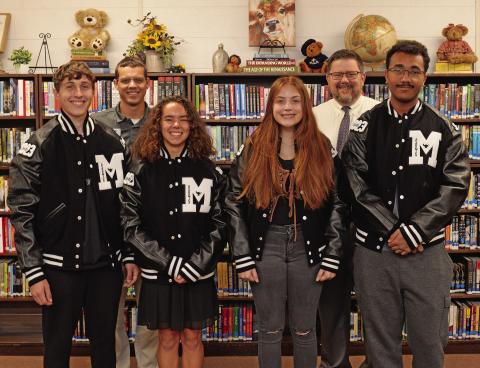 Meeker High School and Vision Bank presented academic letterjackets to seniors last week. Pictured from left are Devin Sligar, Brittany McDoulett, Lauren Miller and Levi Winn. Ashely Adams was unavailable for the photo. In the back row are Derrik Shouse, Vision Branch Manager in Meeker, left, and Meeker High School Principal Brad Buxton. Photo/Brian Blansett