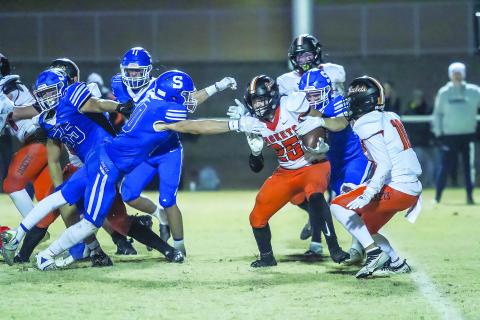 Jacob Beck and Trystan Baker bring down a Fairview ballcarrier. Also picrtured for Stroud are Stetson Bunyard and Kyle Guest. Photo/Mario Holland