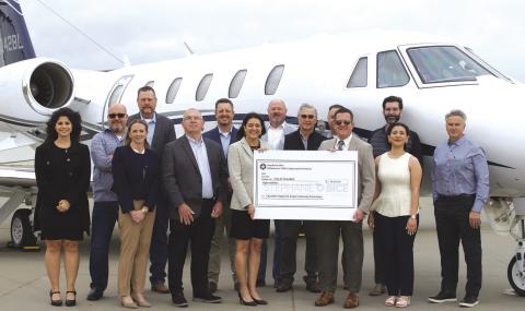Bice delivers check to Chandler airport project