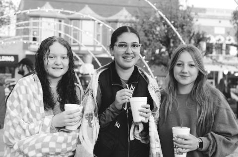 Ricki Guinn, Kaydence Harris and Hadlee Harris kept away the chill with blankets and hot chocolate at the Christmas Festival in Chandler last week. Ricki is from Davenport. Kaydence and Hadlee are from Chandler. Photo/Brian Blansett