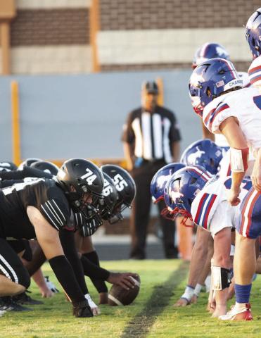 Chandler’s defensive line digs in as Lone Grove pepares to snap the ball from inside the one-yard line during the first half Friday night. Photo/ rian Blansett