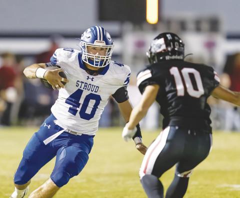 Stroud senior Kason Presley (40) packs the ball for the 5-0 Tigers against Meeker Friday night. Photo/Rick Hester