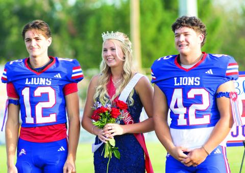 Blaklei Smith was crowned queen of Chandler’s 2025 Homecoming Friday night before the footall game with Clinton. She is a junior and was escorted by Clayton Ritchie, left, and Sam Hall. Photo/Brian Blansett