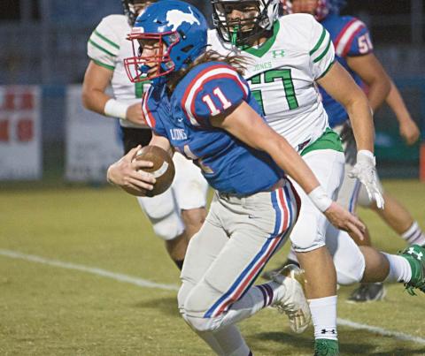 Chandler quarterback Kaden Jones makes a cut on his way to a first-half touchdown on Friday. Photo/Brian Blansett