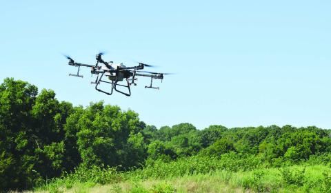 A drone flies over a dam at a watershed located north of Meeker