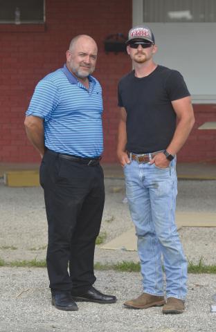 Charles Palmer (left) and Cody Paige (Right), the new owners of the Skyliner Motel, stand together in front of their Stroud motel, which is currently under renovation. Photo/Bradley Jager