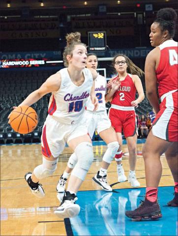 Above, Leah Brannon (10) drives the lane against McLoud’s Cheyenne Banks.