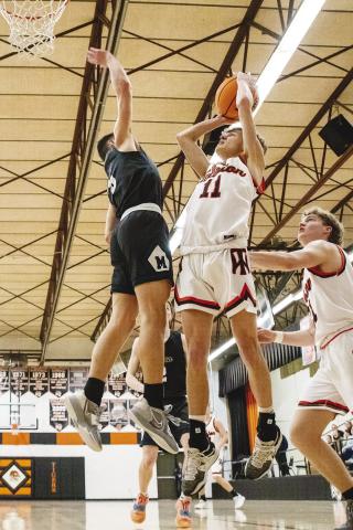 Lane Kulp (11) puts up a baseline shot for Wellston during the Tigers’ 72-62 win over Minco last week. The win put the WTs at 16-6 going into the season finale at Riverfield Tuesday night. The Wellston girls lost, 57-30, to Minco to go to 10-12 for the year. Both teams will be in district play against Davenport at Coyle Friday. Photo/Jeremy Self