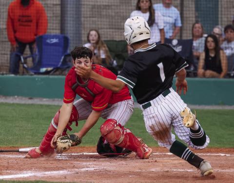 Dale catcher Ethan Douglas eyes an Am-Po baserunner during the first round of the state tournament. Photo/Rick Hester