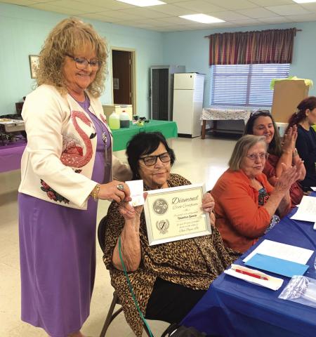 Pam Hunt presents the 60-Year Member award to Sandy Jones.