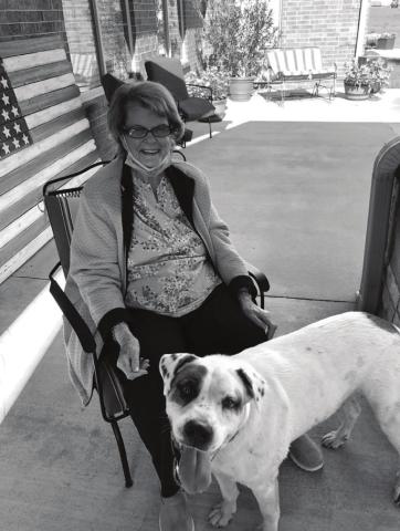 Resident Keturah Brown greets Buddy Hodgens, the only visitor allowed at Prairie Pointe without a mask. Photo/submitted.