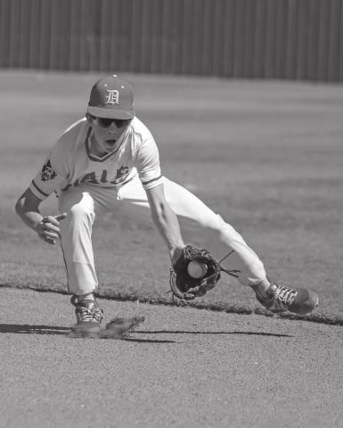 Easton Edmondson scoops up a grounder during Dale’s district tournament win over Calumet. Photo/Rick Hester